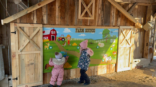 Guests interacting with barnyard sound board