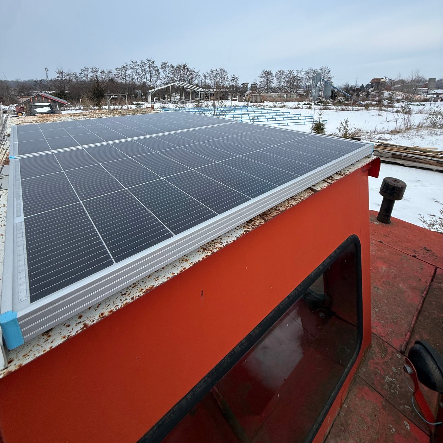 Harvest control solar panels installed ontop of combine cab roof